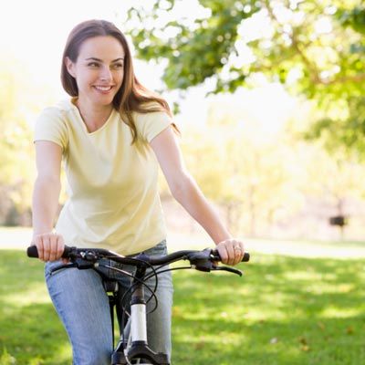 Woman riding a bicycle outdoors